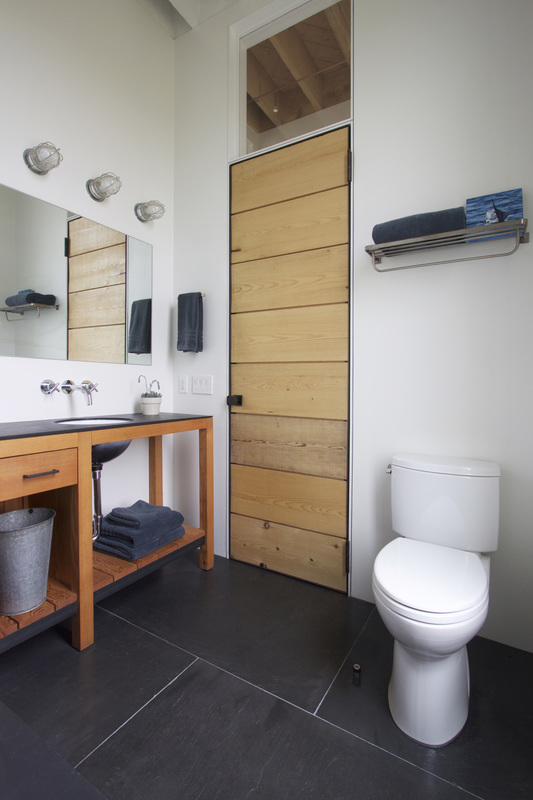 QUARTER design studio + EngineHouse | Seaside Residence | Block Island, RI – master bathroom with reclaimed chalkboard slate floor and custom door and vanity